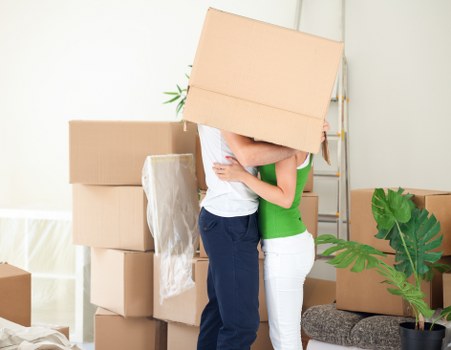 Boxes and furniture being loaded from a Hendon flat