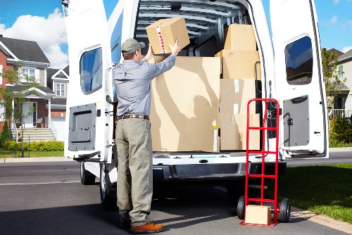 Movers wrapping furniture for a local house removal