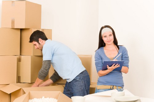 Local moving team loading furniture into a removal van