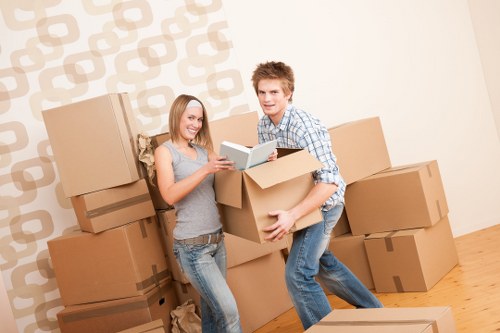 Local movers handling careful unloading at a Hendon property